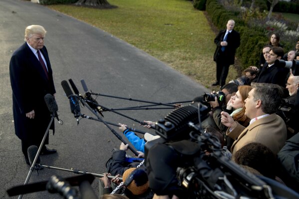 
              President Donald Trump takes a question from CNN reporter Jim Acosta, right, before boarding Marine One on the South Lawn of the White House in Washington, Tuesday, Nov. 20, 2018, for a short trip to Andrews Air Force Base, Md., and then on to Palm Beach Fla. (AP Photo/Andrew Harnik)
            