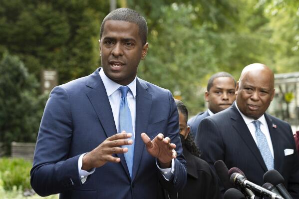 Bakari Sellers, the attorney for the families of victims killed in the 2015 Mother Emanuel AME Church massacre, speaks with reporters outside the Justice Department, in Washington, Thursday, Oct. 28, 2021. Families of nine victims killed in a racist attack at the Black South Carolina church have reached a settlement with the Justice Department over a faulty background check that allowed Dylann Roof to purchase the gun he used in the 2015 massacre.  (AP Photo/Cliff Owen)