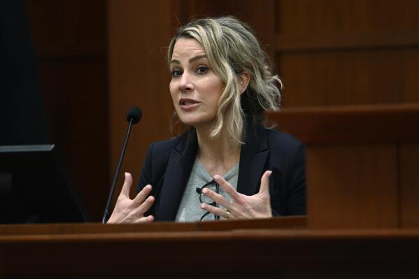 Clinical and forensic psychologist Dr. Shannon Curry, testifies in the courtroom at the Fairfax County Circuit Court in Fairfax, Va., Tuesday, April 26, 2022. Actor Johnny Depp sued his ex-wife actress Amber Heard for libel in Fairfax County Circuit Court after she wrote an op-ed piece in The Washington Post in 2018 referring to herself as a "public figure representing domestic abuse." (Brendan Smialowski/Pool Photo via AP)