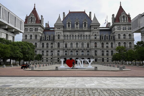 FILE - The New York state Capitol is seen in Albany, N.Y., Tuesday, June 20, 2023. New York is requiring state health officials to develop an outreach program to educate parents and doctors on the harmful impacts of medically unnecessary treatments performed on infants born with physical traits that don't fit typical definitions for male or female categories. (AP Photo/Hans Pennink, File)