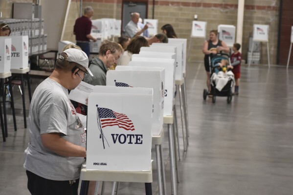 Voters cast ballots at the MetraPark events center, Tuesday, June 4, 2024, in Billings, Mont. The primary election included candidates for president, U.S. Senate, governor and other offices. (AP Photo/Matthew Brown)
