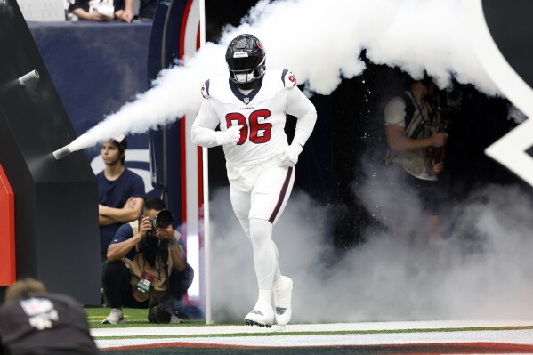 Houston Texans defensive tackle Maliek Collins is introduced before an NFL football game against the Indianapolis Colts, Sep. 17, 2023, in Houston. The San Francisco 49ers have added more help to their defensive line, acquiring Collins in a trade from Houston for a seventh-round draft pick. (AP Photo/Tyler Kaufman)