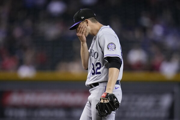 Rockies fall behind early, score 5 in 9th to beat Rangers