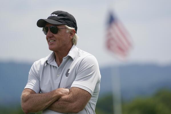 FILE - LIV Golf CEO and Commissioner Greg Norman watches play during the pro-am of the Bedminster Invitational LIV Golf tournament in Bedminster, N.J., July 28, 2022. Rory McIlroy thought his differences with Norman over a Saudi-funded golf league had been patched up. That changed when Norman accused him of being “brainwashed” by golf's ruling brass. “I thought, You know what? I'm going to make it my business now to be as much of a pain in his arse as possible,'” McIlroy said in a lengthy interview in the Sunday Independent in Ireland. (AP Photo/Seth Wenig, File)