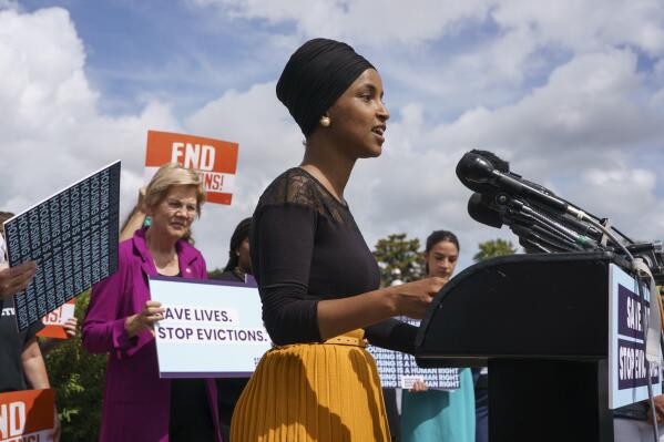 FILE - In this Sept. 21, 2021, file photo Rep. Ilhan Omar, D-Minn., joined at left by Sen. Elizabeth Warren, D-Mass., and Rep. Alexandria Ocasio-Cortez, D-N.Y., right, speaks about the Keeping Renters Safe Act of 2021, at the Capitol in Washington. (AP Photo/J. Scott Applewhite, File)