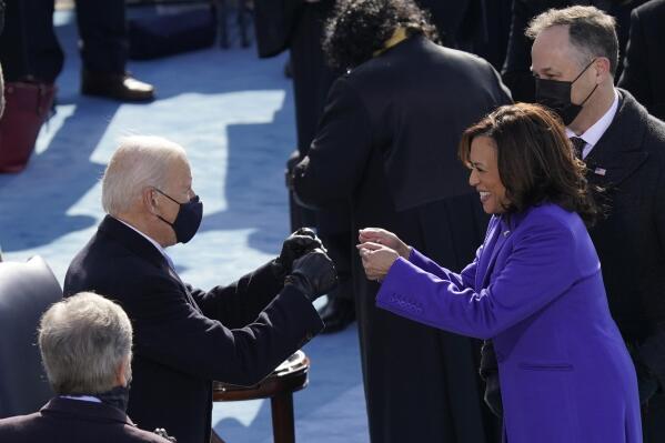 FILE - In this Jan. 20, 2021, file photo President-elect Joe Biden congratulates Vice President Kamala Harris after she was sworn in during the 59th Presidential Inauguration at the U.S. Capitol in Washington. Biden will mark his 100th day in office on Thursday, April 29. (AP Photo/Carolyn Kaster, File)