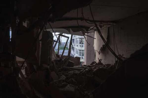 An apartment of a residential multi-storey building is seen damaged after a Russian drone strike on Kyiv, Ukraine, on Friday, June 6, 2025. (AP Photo/Evgeniy Maloletka)