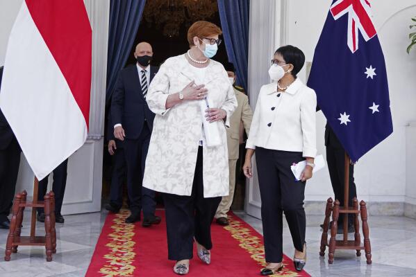In this photo released by the Indonesian Ministry of Foreign Affairs, Australian Foreign Minister Marise Payne, second left, and Defense Minister Peter Dutton, rear left, walk with their Indonesian counterpart Retno Marsudi, right, and Prabowo Subianto, rear right, after their meeting in Jakarta, Indonesia, Thursday, Sept. 9, 2021. Australia's foreign and defense ministers are visiting Indonesia, India, South Korea and the United States to bolster economic and security relationships within the Asia-Pacific region, where tensions are rising with China. (Indonesian Ministry of Foreign Affairs via AP)