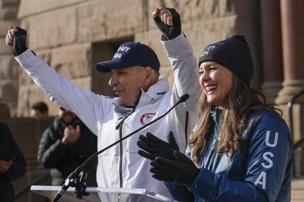 Fraser Bullock, left, president and CEO of the Salt Lake City-Utah Committee for the Games and Salt Lake City Mayor Erin Mendenhall celebrate at City Hall, Wednesday, Nov. 29, 2023, following the announcement by the International Olympic Committee of Salt Lake City as a 