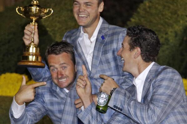 Europe's Martin Kaymer, Graeme McDowell and Justin Rose have some fun after winning the Ryder Cup PGA golf tournament Sunday, Sept. 30, 2012, at the Medinah Country Club in Medinah, Ill. (AP Photo/Chris Carlson)