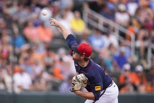 Atlanta Braves starting pitcher Bryce Elder throws in the third inning of a spring training baseball game against the Baltimore Orioles in North Port, Fla., Friday, March 1, 2024. (AP Photo/Gerald Herbert)