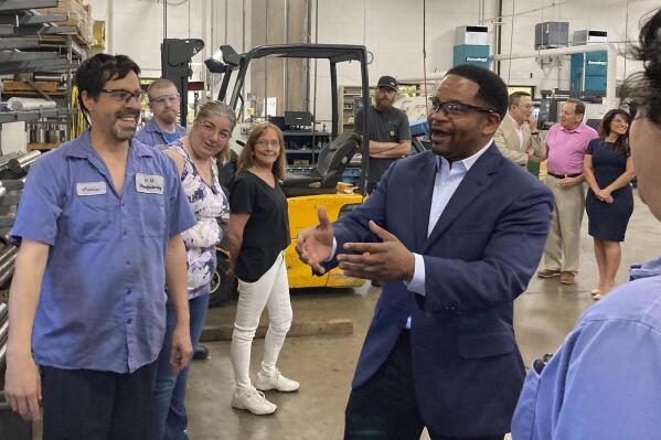 FILE - Republican candidate for Illinois governor Richard Irvin speaks with employees during a tour of HM Manufacturing Inc. in Wauconda, Ill., June 21, 2022. Irvin is seeking the Republican nomination to face Democratic Gov. J.B. Pritzker in November. (AP Photo/Sara Burnett, File)