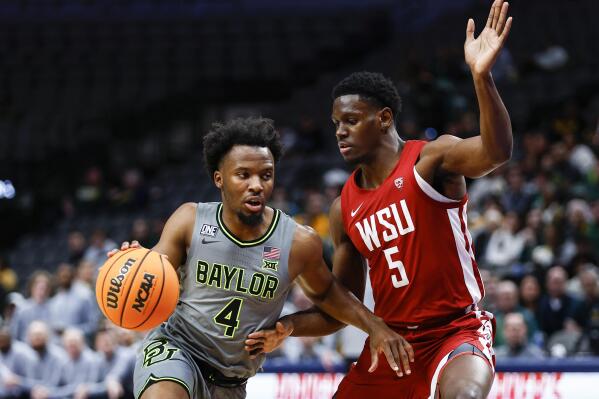 Baylor guard LJ Cryer (4) battles Washington State guard TJ Bamba (5) for space during the first half of an NCAA college basketball game on Sunday, Dec. 18, 2022, in Dallas. (AP Photo/Brandon Wade)