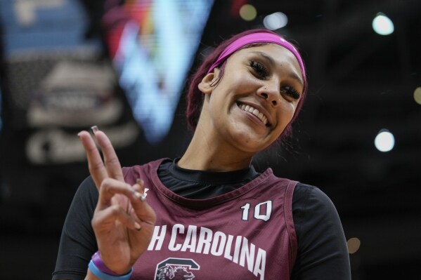 South Carolina's Kamilla Cardoso gestures to fans during practice for the NCAA Women's Final Four championship basketball game Saturday, April 6, 2024, in Cleveland. (AP Photo/Morry Gash)