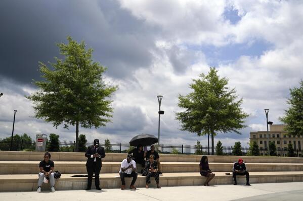 People attend a voting rights rally at Liberty Plaza near the Georgia State Capitol on Tuesday, June 8, 2021, in Atlanta. (AP Photo/Brynn Anderson)