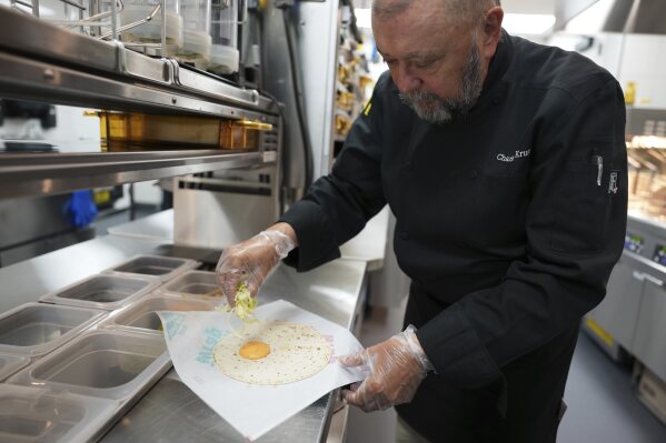 Charles L. Krumsiek, a McDonald's chef, makes a snack wrap (ranch) at McDonald's Headquarter in Chicago, Thursday, May 29, 2025. (AP Photo/Nam Y. Huh)