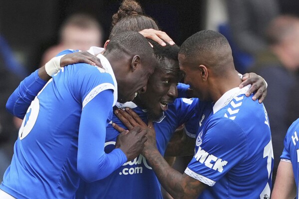 Everton's Idrissa Gueye, center, celebrates scoring with teammates during the English Premier League soccer match between Everton and Nottingham Forest at Goodison Park, Liverpool, England, Sunday April 21, 2024. (Peter Byrne/PA via AP)