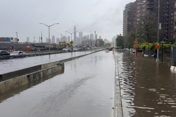 In this image taken from video, a section of the FDR Drive sits submerged in flood waters, Friday, Sept. 29, 2023, in New York. A potent rush-hour rainstorm has swamped the New York metropolitan area. The deluge Friday shut down swaths of the subway system, flooded some streets and highways, and cut off access to at least one terminal at LaGuardia Airport. (AP Photo/Jake Offenhartz)