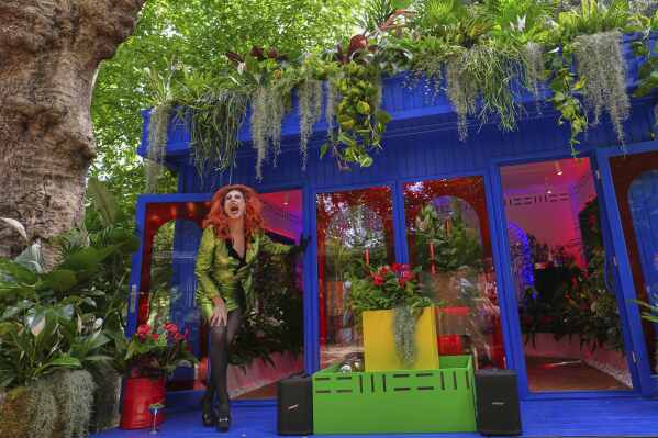 Drag artist Ula Lah performs as Mother Nature at the Babylon Beat indoor Garden at the RHS Chelsea Flower Show in London, Monday, May 19, 2025. (AP Photo/Kirsty Wigglesworth)