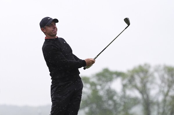 Rory McIlroy, of Northern Ireland, hits on the 14th hole during the second round of the Truist Championship golf tournament at the Philadelphia Cricket Club, Friday, May 9, 2025, in Flourtown. (AP Photo/Matt Rourke)