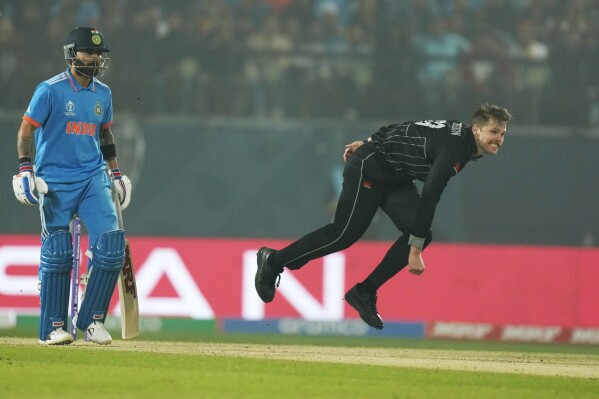 New Zealand's Lockie Ferguson bowls during the ICC Men's Cricket World Cup match between India and New Zealand in Dharamshala, India, Sunday, Oct. 22, 2023. (AP Photo/Ashwini Bhatia)