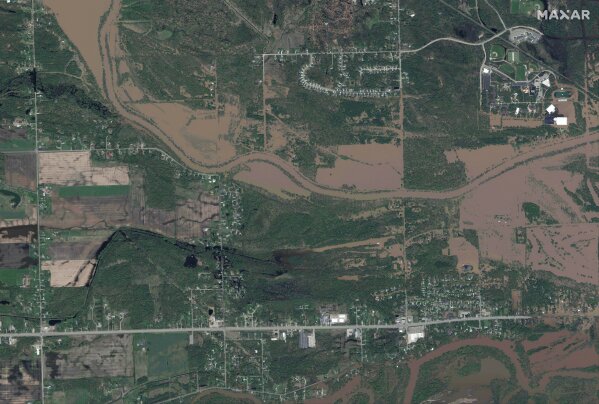 This photo provided by Maxar Technologies shows the flooded Tittabawassee River around the areas in Midland, Mich., Wednesday, May 20, 2020. (Maxar Technologies via AP)
