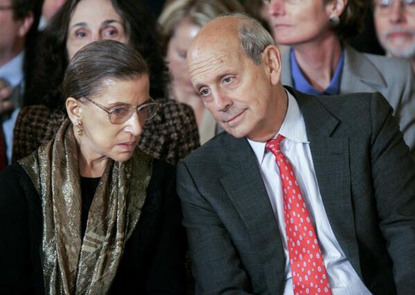 FILE - Supreme Court Associate Justices Ruth Bader Ginsburg, left, and Stephen Breyer talk prior to a ceremonial swearing-in ceremony for new Supreme Court Justice Samuel Alito in the East Room of the White House, Feb. 1, 2006. (AP Photo/Gerald Herbert, File)