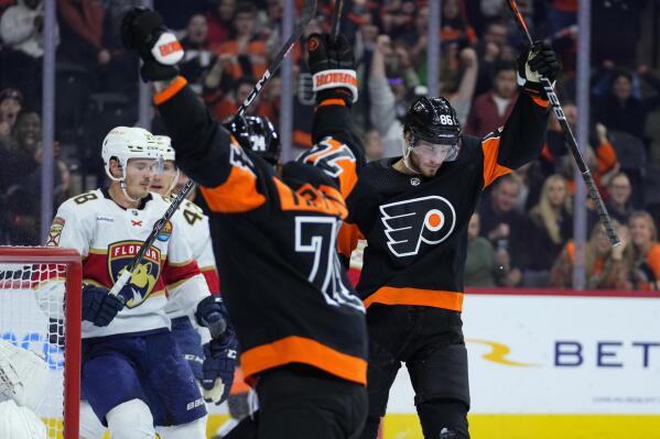 Philadelphia Flyers' Joel Farabee, right, celebrates after scoring a goal during the second period of an NHL hockey game against the Florida Panthers, Thursday, Oct. 27, 2022, in Philadelphia. (AP Photo/Matt Slocum)