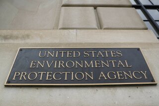This Sept. 21, 2017 file photo shows the Environmental Protection Agency (EPA) Building in Washington. Criminal prosecution and convictions of polluters haven fallen to quarter-century lows under the Trump administration. That’s according to Justice Department figures for fiscal year 2019. The EPA says it’s improved in some other enforcement categories. But a former EPA agent in charge says three years of declines show the agency dismantling criminal enforcement. (AP Photo/Pablo Martinez Monsivais)