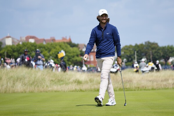 England's Tommy Fleetwood smiles after a birdie putt on the 16th hole on the first day of the British Open Golf Championships at the Royal Liverpool Golf Club in Hoylake, England, Thursday, July 20, 2023. (AP Photo/Jon Super)