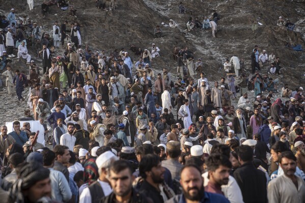 Afghan refugees settle in a camp near the Torkham Pakistan-Afghanistan border, in Torkham, Afghanistan, Friday, Nov. 3, 2023. A huge number of Afghan refugees entered the Torkham border to return home hours before the expiration of a Pakistani government deadline for those who are in the country illegally to leave or face deportation. (AP Photo/Ebrahim Noroozi)