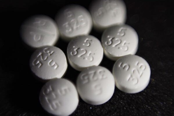 FILE - This Aug. 15, 2017 file photo shows an arrangement of pills of the opioid oxycodone-acetaminophen, also known as Percocet, in New York. Ohio is ready to begin distributing millions of dollars in opioid settlement money to community and government organizations, an influx eagerly anticipated since the first sums were secured in 2021. The OneOhio Recovery Foundation, which has been tasked with distributing over $860 million of settlements reached with drugmakers and pharmaceutical companies for their roles in the national opioid crisis, plans to release its formal request for proposals Monday, March 4, 2024. (AP Photo/Patrick Sison, File)