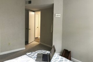 In this May 13, 2020, photo, a "Joy" sign hangs on the wall of Associated Press News Associate Haleluya Hadero's bedroom in Atlanta. It is often the first thing she sees when she gets up every morning. (AP Photo/Haleluya Hadero)