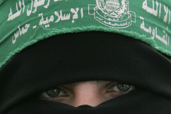 FILE - A Palestinian Hamas supporter attends a protest against Israel's attacks on the Gaza Strip, in Gaza City, on March 3, 2008. In the three and a half decades since it began as an underground militant group, Hamas has pursued a consistently violent strategy aimed at rolling back Israeli rule. Despite bringing enormous suffering to both sides of the conflict, it has made steady progress. But its stunning incursion into Israel over the weekend marks its deadliest gambit yet, and the already unprecedented response from Israel threatens to bring an end to its 16-year rule over the Gaza Strip. (AP Photo/Khalil Hamra, File)