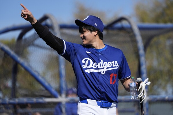 Los Angeles Dodgers designated hitter Shohei Ohtani (17) participates in spring training baseball workouts at Camelback Ranch in Phoenix, Friday, Feb. 16, 2024. (AP Photo/Ashley Landis)