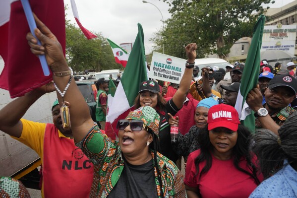 People protest against the recent increase in the electricity tariff, in Abuja Nigeria, Monday, May 13, 2024. Labor unions in Nigeria staged nationwide have protested a recent increase in electricity prices introduced after the removal of subsidies by the West African nation’s government. (AP Photo/Sunday Alamba)