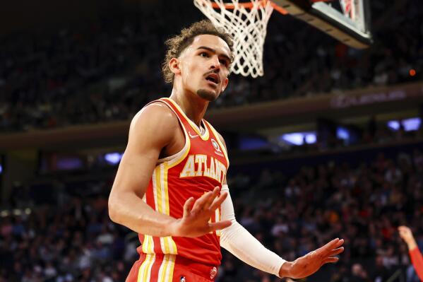 Atlanta Hawks guard Trae Young (11) motions to the crowd during the first half of an NBA basketball game against the New York Knicks, Tuesday, March 22, 2022, in New York. (AP Photo/Jessie Alcheh)