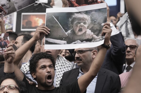 Egyptian protesters shout anti-Israel slogans during a demonstration to show solidarity with Palestinians, in front of the Journalists Syndicate in Cairo, Egypt, Wednesday, Oct. 18, 2023. (AP Photo/Amr Nabil)