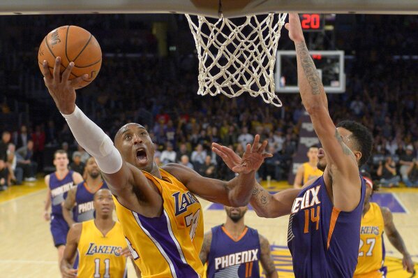 Los Angeles Lakers guard Kobe Bryant makes a dunk against the Phoenix Suns  during the second half of Game 1 of their Western Conference Finals series  at Staples Center in Los Angeles