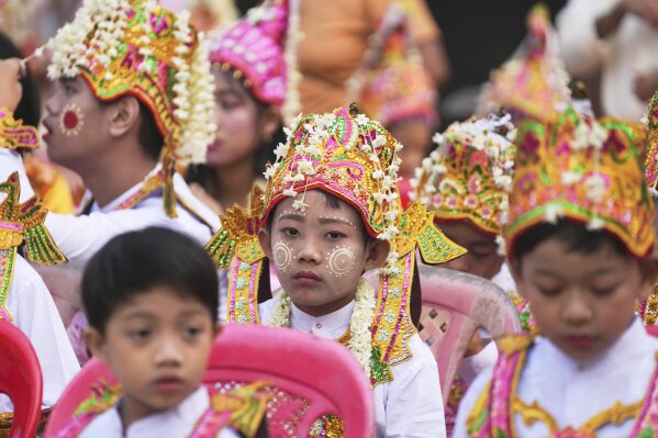 Children who are to become Buddhist novices wait for a processional parade as part of a celebration of a novitiation or “Shinbyu,” ceremony, Saturday, March 15, 2025, at Hlegu township, outside of Yangon, Myanmar. (AP Photo/Thein Zaw)
