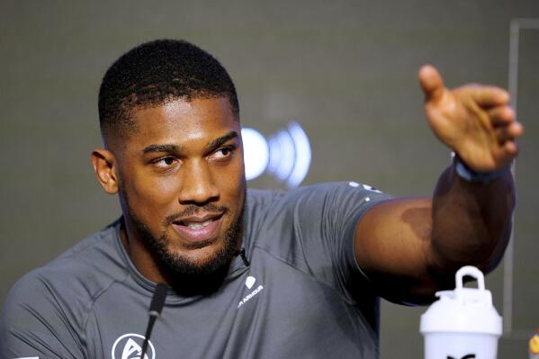 Britain's Anthony Joshua takes part in a press conference at Nobu Hotel, in London, Wednesday March 29, 2023. The stakes are high for Anthony Joshua in a fight that comes at a crossroads in his career. The former two-time world champion takes on American boxer Jermaine Franklin at London’s O2 Arena on Saturday. (Zac Goodwin/PA via AP)