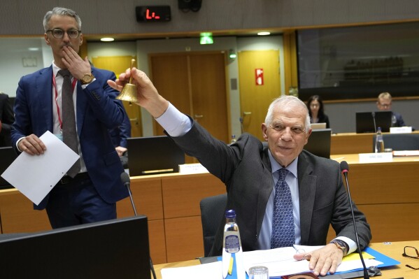 European Union foreign policy chief Josep Borrell rings a bell to signify the start of a meeting of EU foreign ministers at the European Council building in Brussels, Monday, March 18, 2024. European Union foreign ministers on monday will discuss Russia's aggression against Ukraine, Belarus, and the situation in the Middle East. (AP Photo/Virginia Mayo)