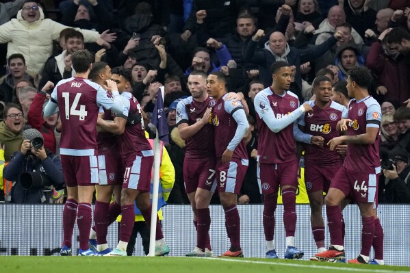 Aston Villa players celebrate after Ollie Watkins scored their second goal during the English Premier League soccer match between Tottenham Hotspur and Aston Villa at the Tottenham Hotspur stadium in London, Sunday, Nov. 26, 2023. (AP Photo/Kirsty Wigglesworth)