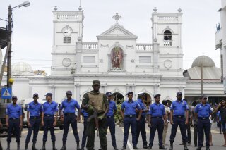 Sri Lankan Army soldiers secure the area around St. Anthony's Shrine after a blast in Colombo, Sri Lanka, Sunday, April 21, 2019. A Sri Lanka hospital spokesman says several blasts on Easter Sunday have killed dozens of people. (AP Photo/Eranga Jayawardena)
