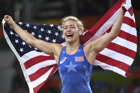 FILE - United States' Helen Louise Maroulis celebrates after beating Japan's Saori Yoshida for the gold during the women's wrestling freestyle 53-kg competition at the 2016 Summer Olympics in Rio de Janeiro, Brazil, Thursday, Aug. 18, 2016. She is aiming to become the first American women’s wrestler to win three Olympic medals. She won gold in 2016 and bronze in Tokyo and is competing in the 57-kilogram division in Paris. (Ryan Remiorz/The Canadian Press via AP, File