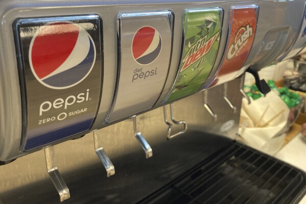 FILE - A soda dispenser machine featuring Pepsi products is shown, Monday, March 27, 2022, in Miami Gardens, Fla. PepsiCo reports earnings on Friday, Feb. 9, 2024. (APPhoto/Wilfredo Lee)