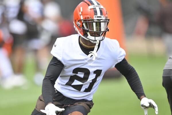 FILE - Cleveland Browns cornerback Denzel Ward participates in a drill during NFL football practice at the team's training facility on June 8, 2022, in Berea, Ohio. Ward will start training camp on the sideline after being placed on the active/physically unable to perform list Tuesday, July 26, 2022, as the Browns await the NFL's ruling on quarterback Deshaun Watson. (AP Photo/David Richard, File)