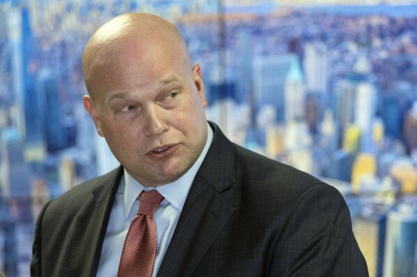 
              In this Nov. 21, 2018 photo, Acting Attorney General Matthew Whitaker, framed by a photograph of lower Manhattan, addresses law enforcement officials at the Joint Terrorism Task Force in New York. Whitaker has been advised by ethics officials that he does not need to recuse himself from overseeing the special counsel’s Russia probe. That’s according to a person familiar with the matter who spoke to The Associated Press on Thursday on condition of anonymity. (AP Photo/Mary Altaffer)
            