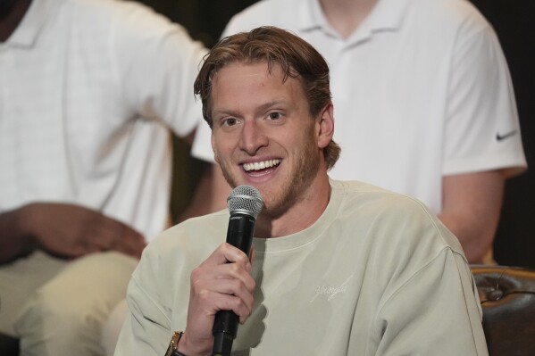 Grant House speaks during a players' association for college athletes meeting ahead of the college football's national title game, Saturday, Jan. 18, 2025, in Atlanta. (AP Photo/Brynn Anderson, File)
