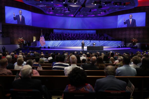 FILE - In this Sunday, June 28, 2020 file photo, Senior Pastor Robert Jeffress addresses attendees before Vice President Mike Pence was to speak at the First Baptist Church Dallas during a Celebrate Freedom Rally in Dallas. Concerning the COVID-19 pandemic, the prominent megachurch leader has said, "If we wanted to have zero risks, the safest thing would be to never open our doors. ... The question is how can you balance risk with the very real need to worship." (AP Photo/Tony Gutierrez)